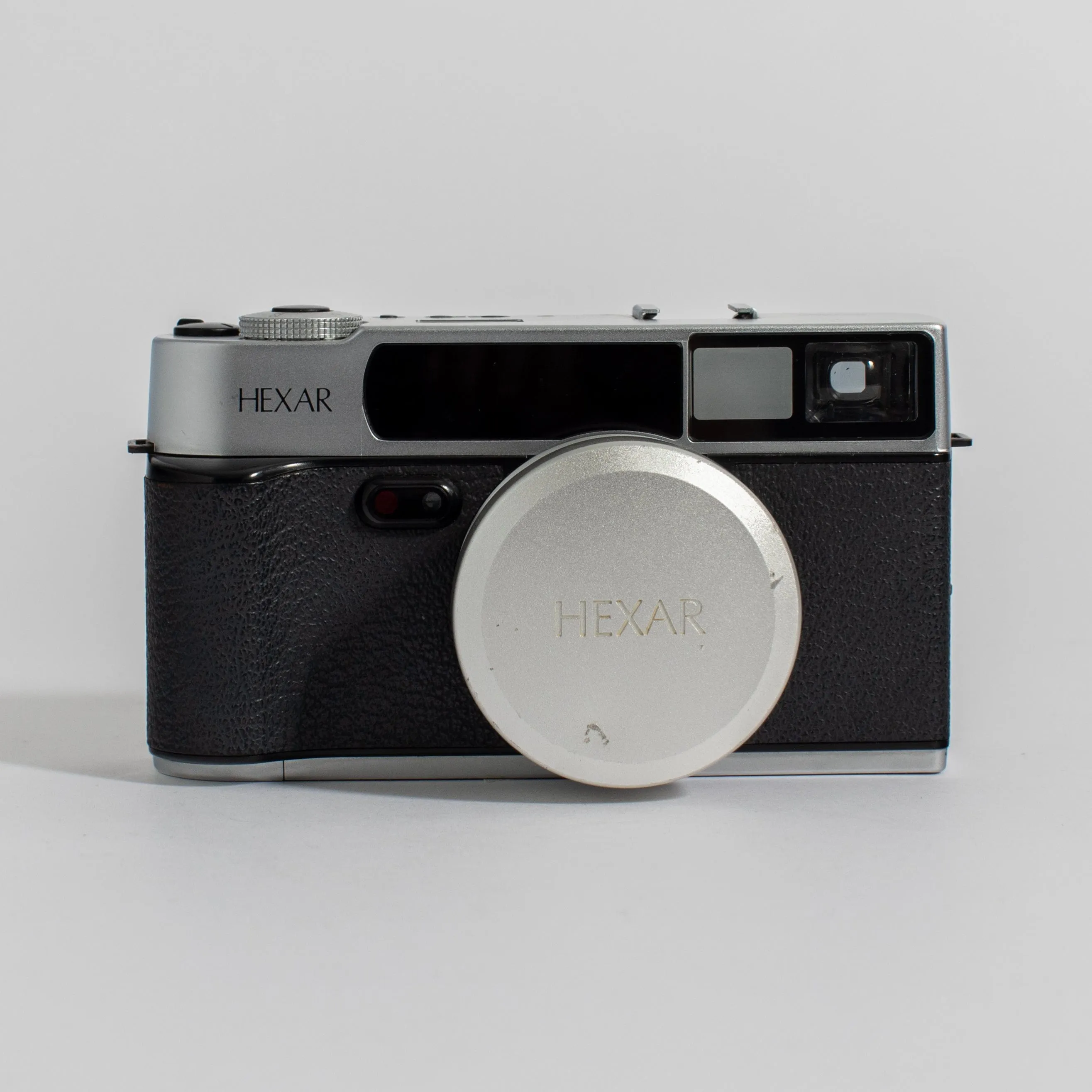 Konica Hexar Silver with 35mm f2 lens, leather case, and strap