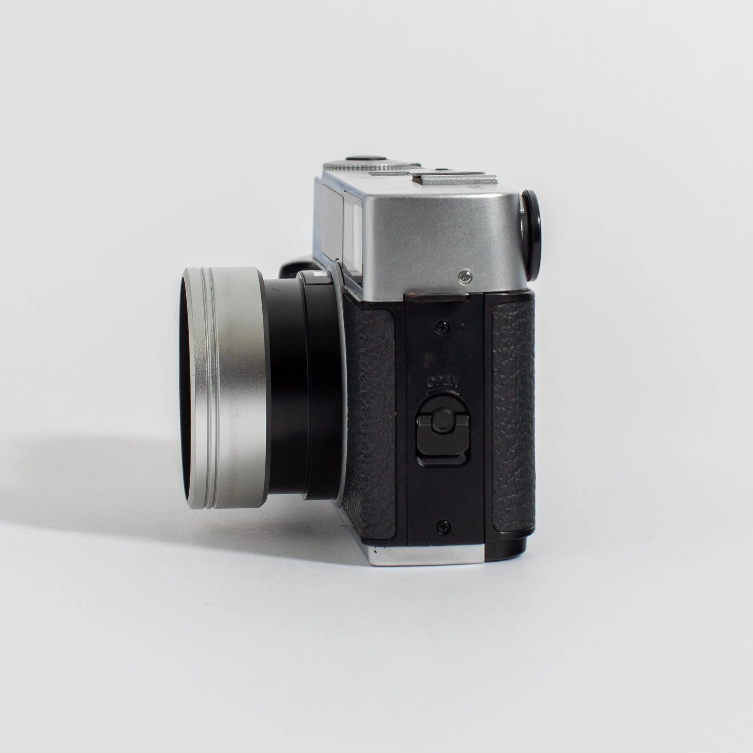 Konica Hexar Silver with 35mm f2 lens, leather case, and strap