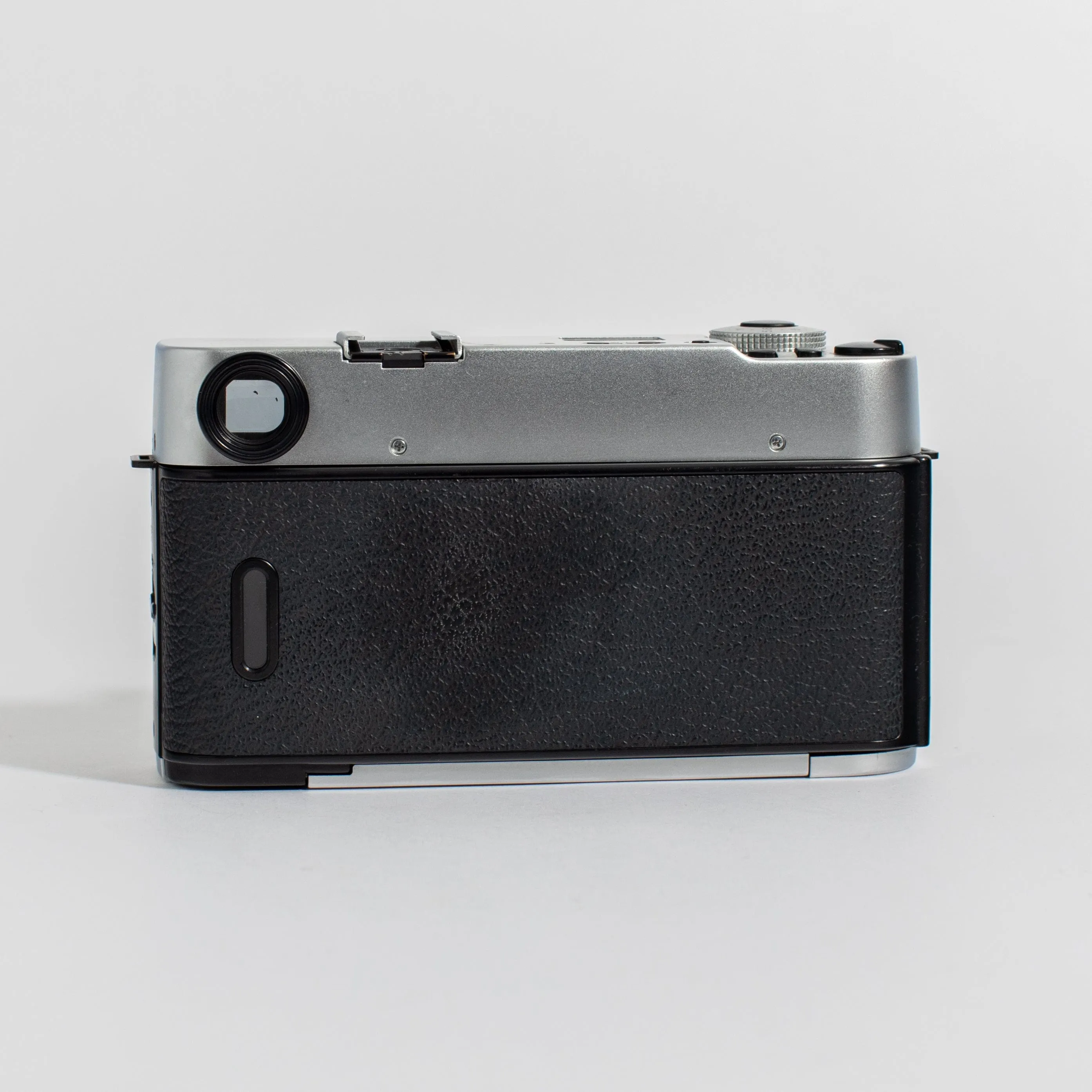 Konica Hexar Silver with 35mm f2 lens, leather case, and strap