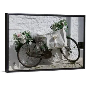 "Bicycle parked against a wall, Trulli House, Alberobello, Apulia, Italy" Black Float Frame Canvas Art